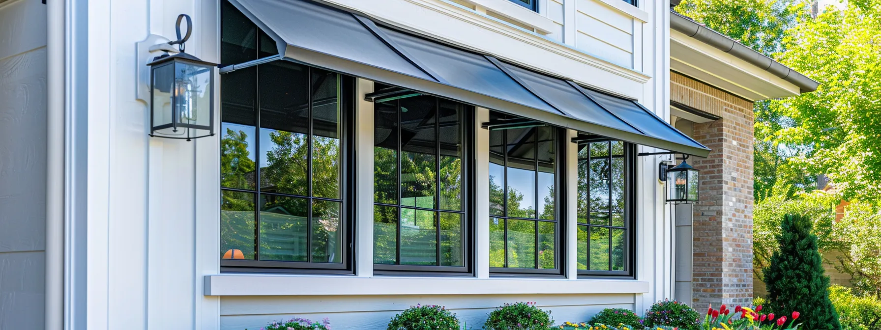 a professional team installing sleek awning windows in a residential home in kansas city.