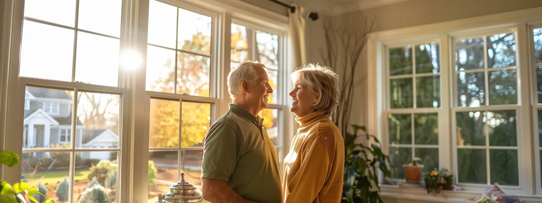 a homeowner happily selecting new windows with a consultant at sunshine home improvement.